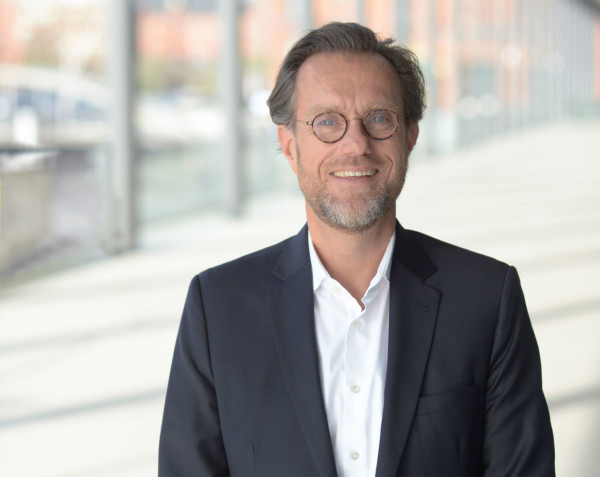 Portraitfoto von Dr. Andreas Kleinau, Vorsitzender der Geschäftsführung der HafenCity Hamburg GmbH