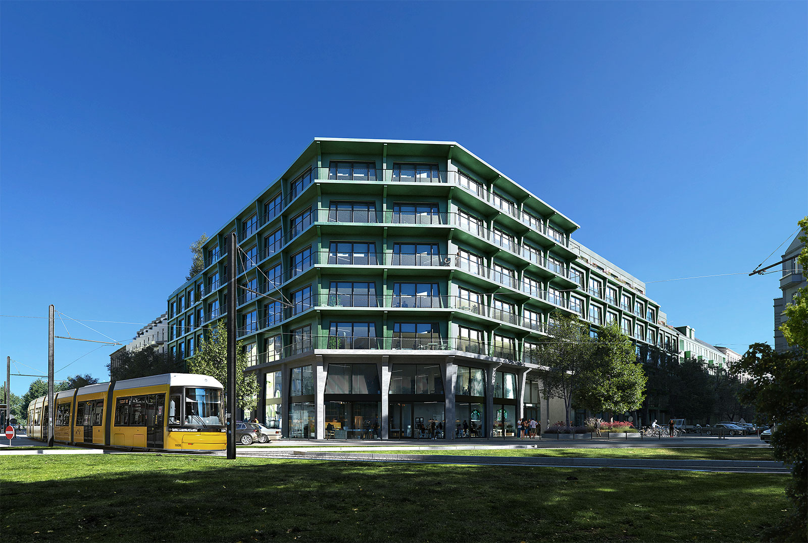 Das Hainwerk in Berlin von vorne. Das gebäude hat eine grüne, metallische Fassade mit großen Fenstern.