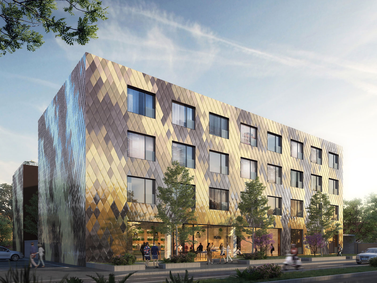 Bauprojekt Aparthotel Mjunic in München: Die Fassade besteht aus vielen rautenförmigen Platten in Gelb- und Brauntönen.