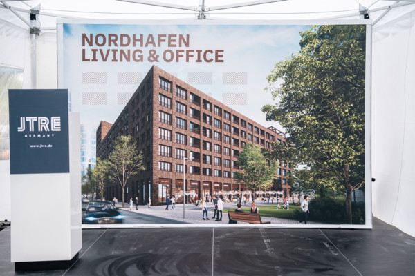 Banner mit Visualisierung des Neubaus Nordhafen Living & Office in Berlin.