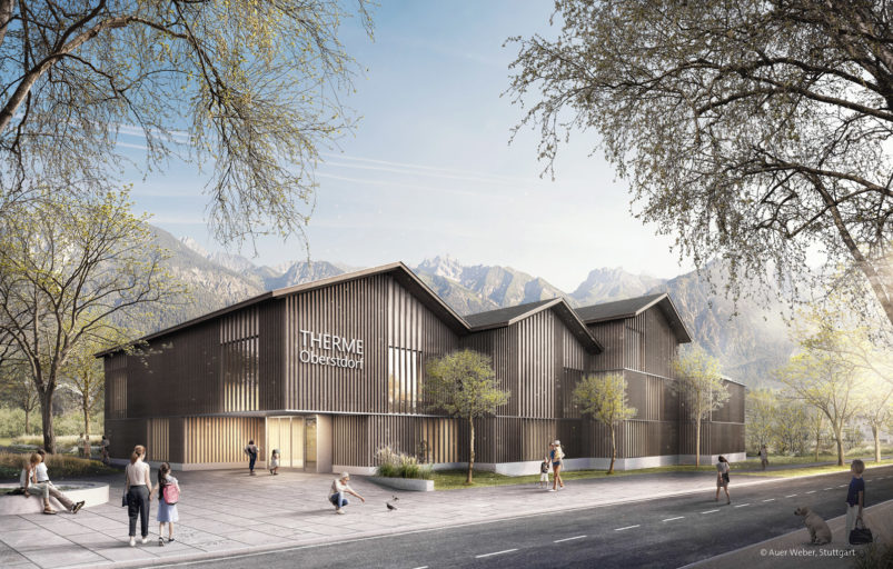 Visualisierung: Neue Therme Oberstdorf. Das Bild zeigt das neue Gebäude mit Holzverkleidung vor einer Bergkette