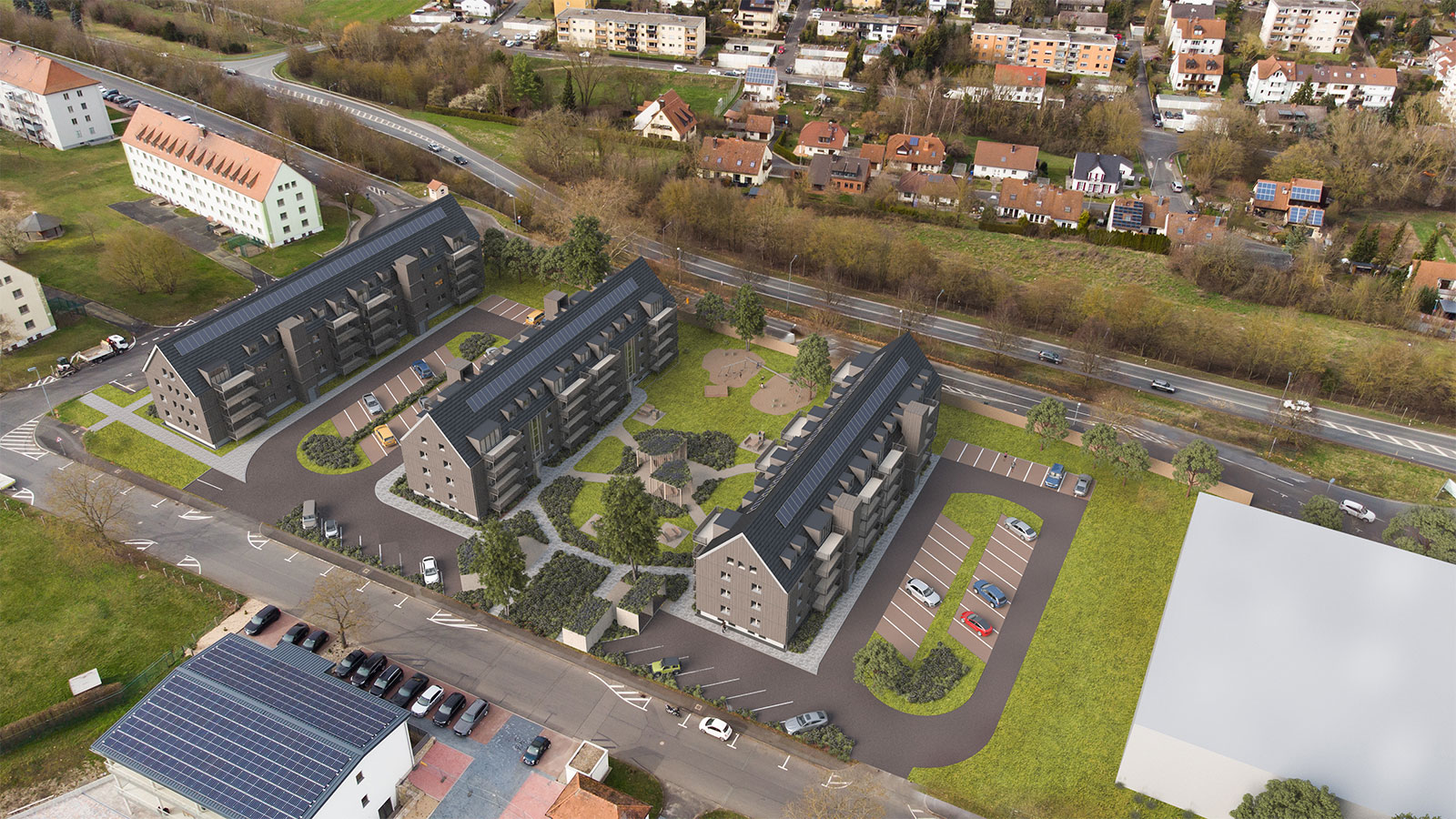 Visualisierung: Das Westquartier 4 in Kitzingen aus Vogelperspektive. 3 Mehrfamilienhäuser mit Spitzdächern
